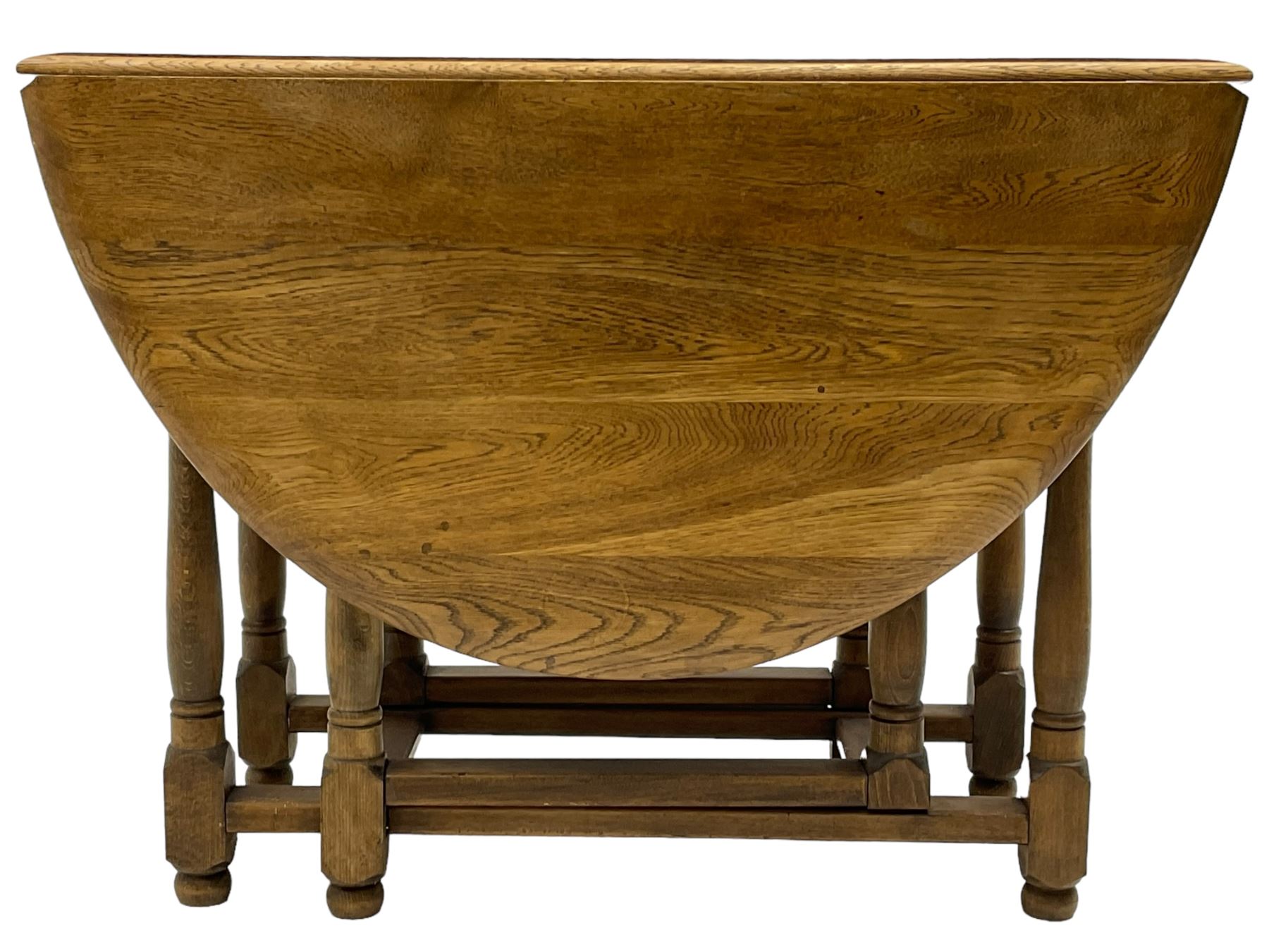 Mid-to-late 20th century oak and beech drop-leaf dining table, gate-leg action base with turned supports
