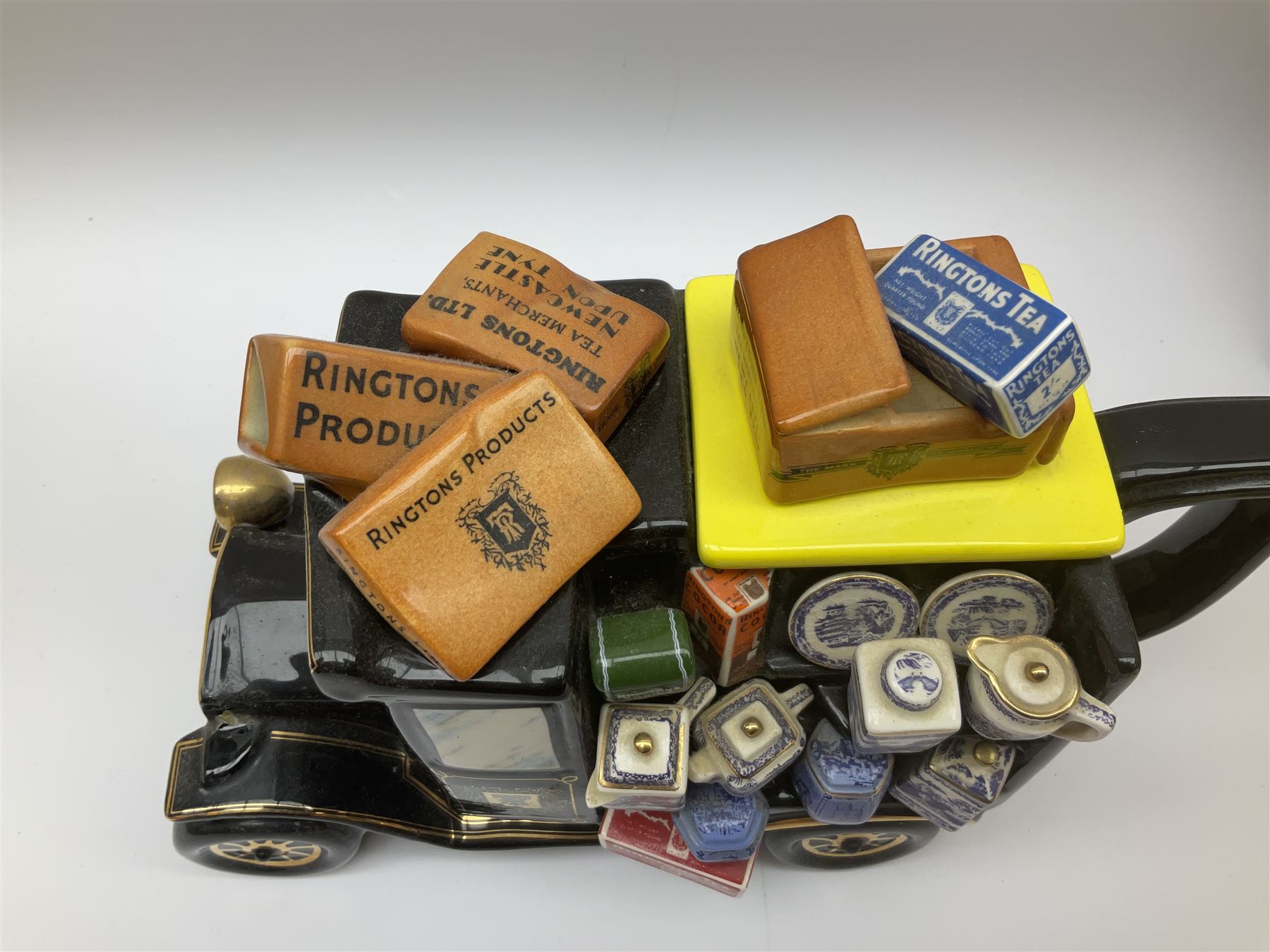 Ringtons novelty teapots, comprising the Ringtons Delivery Van teapot, and the Tea Merchant teapot, both with boxes and certificates of ownership.