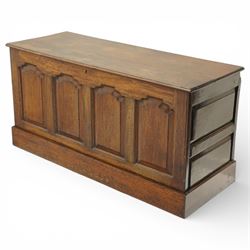 Late 19th century Gothic Revival oak coffer, the plain hinged top over four fielded arch moulded panels, the sides panelled and raised on a block plinth, the interior with vertical boarding and later iron hinges