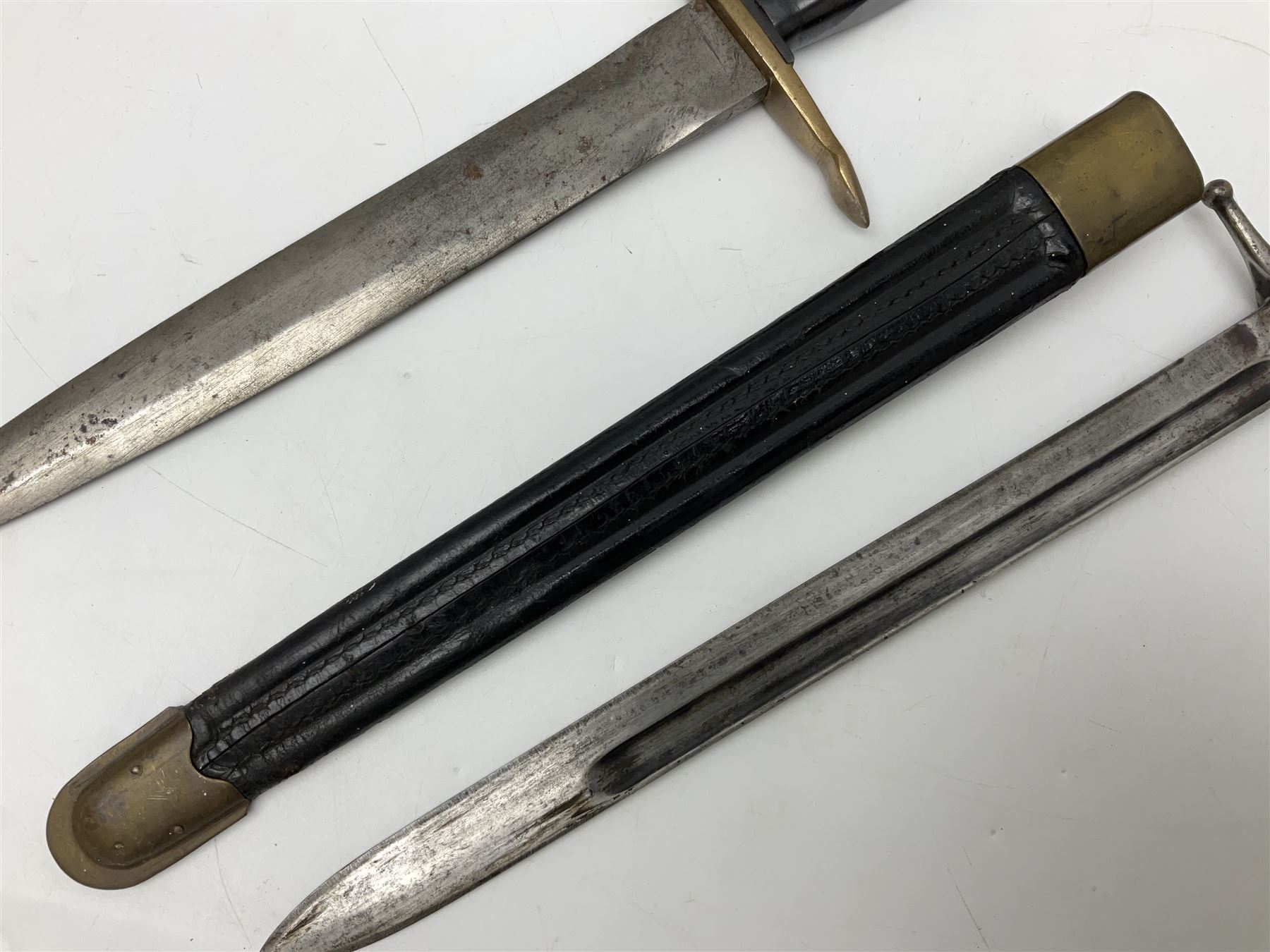 Italian Model 1891 bayonet with 30cm fullered blade; the crosspiece marked 'TERNI'; in associated brass and leather scabbard L43cm overall; and Knights Templar (?) short blade sword (no scabbard) (2)