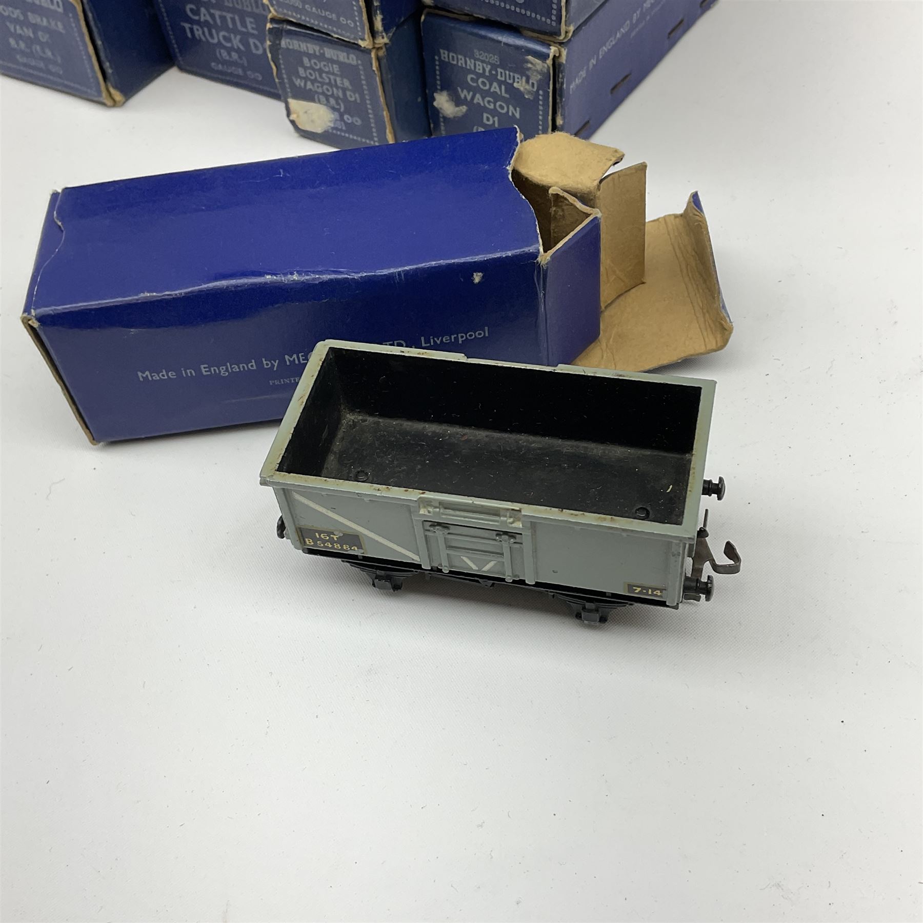 Hornby Dublo - thirteen D1/D2 wagons comprising High Capacity Wagon; Bogie Bolster Wagon; Horse Box; Oil Tank Wagon 'Royal Daylight'; Meat Van; Cattle Truck; Open Wagon; Coal Wagon; Fish Van; Goods Van; Goods Brake Van; Mineral Wagon; and High Sided Wagon; all in dark blue boxes (13)
