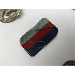 WW1 pair of medals awarded to 151761 Gnr. S. Loten R.A. with ribbons; four WW2 medals with ribbons; and small quantity of cap badges, medallions etc