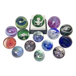 Twelve Caithness glass paperweights, to include Pastel, Mooncrystal and Fiesta, together with Baccarat 'The Princess Anne' paperweight and two Mdina examples (15)