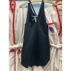 On the direct instructions of Anita Porter nee Lonsbrough Great British Olympic and Commonwealth Games gold medal winning swimmer - collection of early and international memorabilia comprising original Huddersfield Bath Club track suit top bearing eight stitched on cloth badges including British Empire & Commonwealth Games 1958 England Team, YSASA, North Eastern Counties ASA, ESSA Division 3,  English Schools Swimming Association winner etc
The swimming costume Anita wore at the 1958 Commonwealth Games in Cardiff, her first major championships, where she won two gold medals. The grey elastic on the sides, in those days, she would use to make it tighter and more streamlined.
Blue track suit from the 1960 Olympics which she wore on the podium receiving the gold medal.
1960 pool side towelling robe used at the Rome Olympics (interesting to note her name is spelt wrong on the embroidered label).
1962 Commonwealth Games pool side towelling robe used in Perth Australia when winning three Gold medals. 
It was also this year she became BBC Sports Personality of the year, the first female to do so.
Her 'lucky' pool side towel which she took with her to every event she competed in and which can be seen round her neck in many official celebratory photographs. Copies of some of these photographs are included for identification.
In addition there are two souvenir programmes of an evening event to honour Anita at The Theatre Royal Huddersfield and she has kindly signed the front cover on one of these.