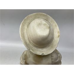 Marble figure of a boy donning a hat stood feeding a pigeon in his left arm with a hound seated by his feet, upon circular base, H41cm
