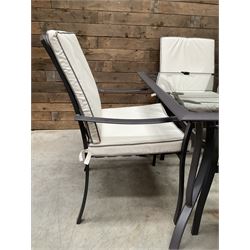 Metal framed garden table with glazed top (W170cm, D102cm, H71cm) and six armchairs with cushions 