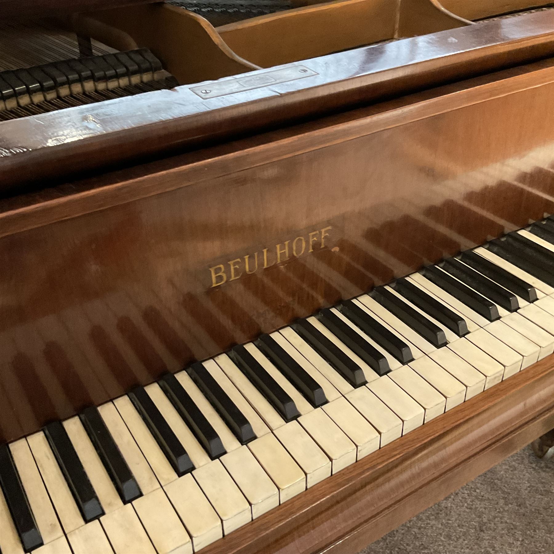 Buelhoff - 20th century German baby grand piano in a mahogany case, with an overstrung cast iron frame, original hammers, dampers, felts, stringing and action, sustain and sostenuto pedals, with an 88 note seven octave keyboard.

This item has been registered for sale under Section 10 of the APHA Ivory Act.