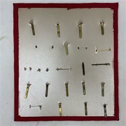 Twenty-two glengarry and cap badges including Argyll & Sutherland, Devonshire, Essex, Hampshire, Royal Berkshire, Northamptonshire, Long Range Desert Group, Royal Corps of Signals, Norfolk, Dorsetshire, East Lancashire etc; mounted on a board for display