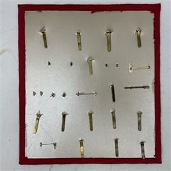 Twenty-two glengarry and cap badges including Argyll & Sutherland, Devonshire, Essex, Hampshire, Royal Berkshire, Northamptonshire, Long Range Desert Group, Royal Corps of Signals, Norfolk, Dorsetshire, East Lancashire etc; mounted on a board for display