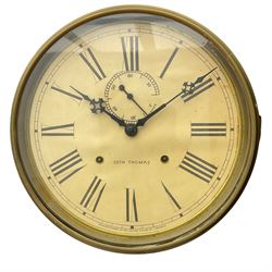 A late 19th century “Seth Thomas” American hexagonal dial wall clock, with a 12” dial within a spun brass bezel and flat glass, with Roman numerals, minute track, subsidiary seconds dial and steel Maltese hands, dial inscribed “Seth Thomas, made in the United States of America”, eight-day spring driven movement striking the hours on a gong, mahogany case with a glazed door and brass slip, visible pendulum and original trade label pasted in the rear of the case.



