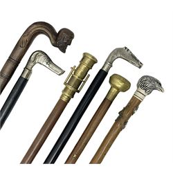 Six walking sticks including a walking stick with telescope to the top, carved resin cap modelled as an eagle with Yorkshire crest etc  