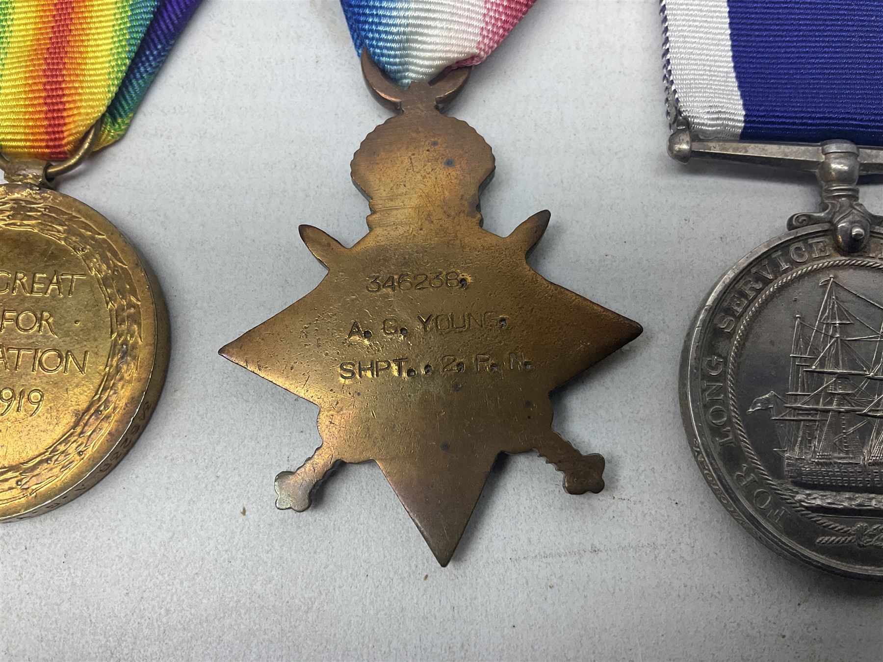 WW1 Naval group of four medals comprising British War Medal, 1914-15 Star and Victory Medal awarded to 346238 A.G. Young SHPT. 2  R.N.; and George V Long Service and Good Conduct Medal awarded to 346238 A.G. Young SHPT. 1 H.M.S. Victory; all with ribbons