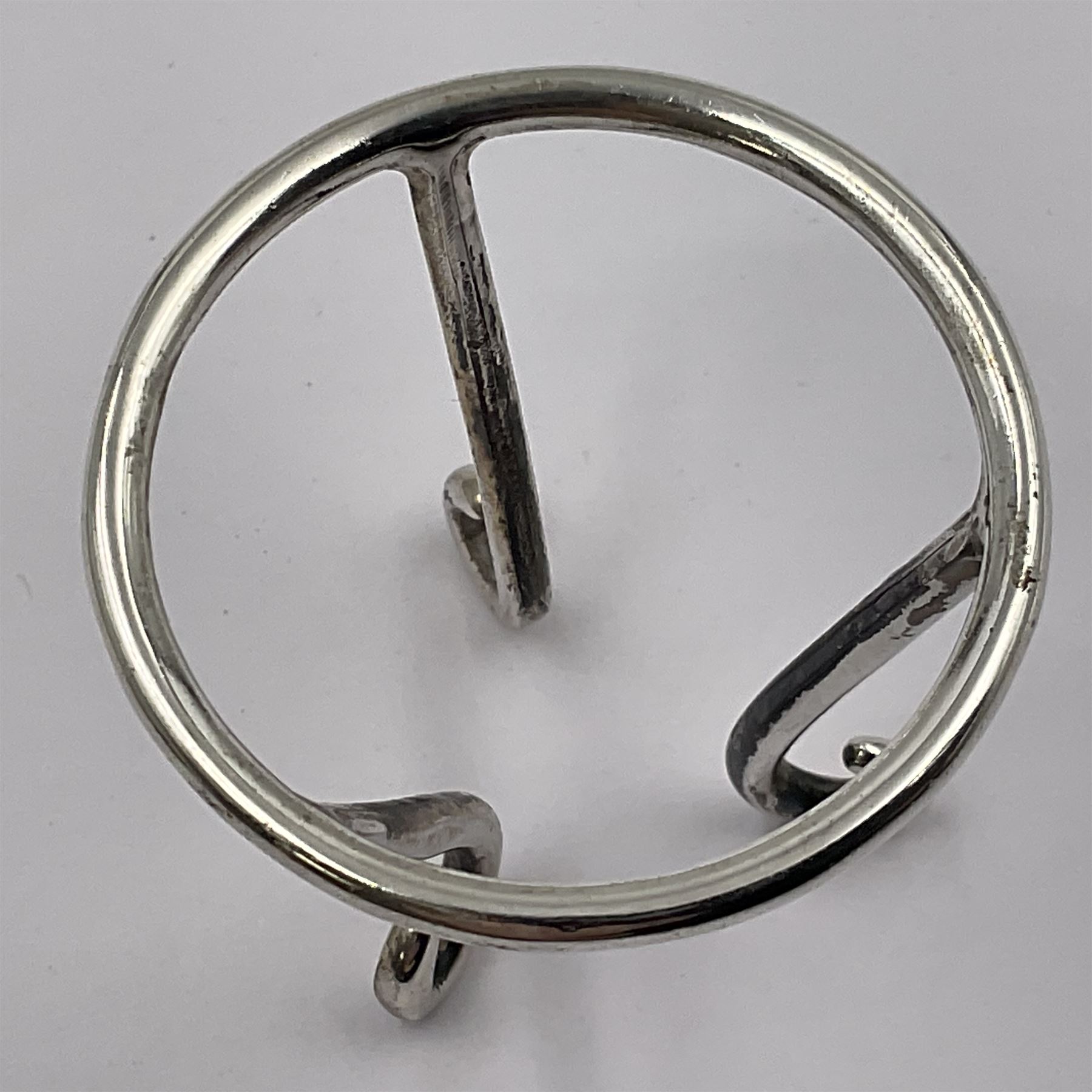 Modern silver limited edition Easter egg, no. 70/500, the openwork lattice body decorated with gilded panels of flower heads, opening to reveal a gilt interior, upon silver stand with three scrolling pad feet, each hallmarked St James House Company, London 1979, height including stand 8cm