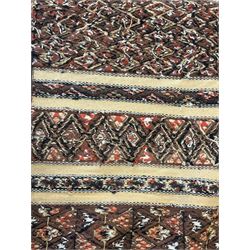 Turkish Kilim ground rug, the field with alternating horizontal bands of geometric patterns, bordered by repeating diamond motifs (145cm x 242cm); Turkish red ground rug, the field with three octagonal medallions (113cm x 172cm) (2)