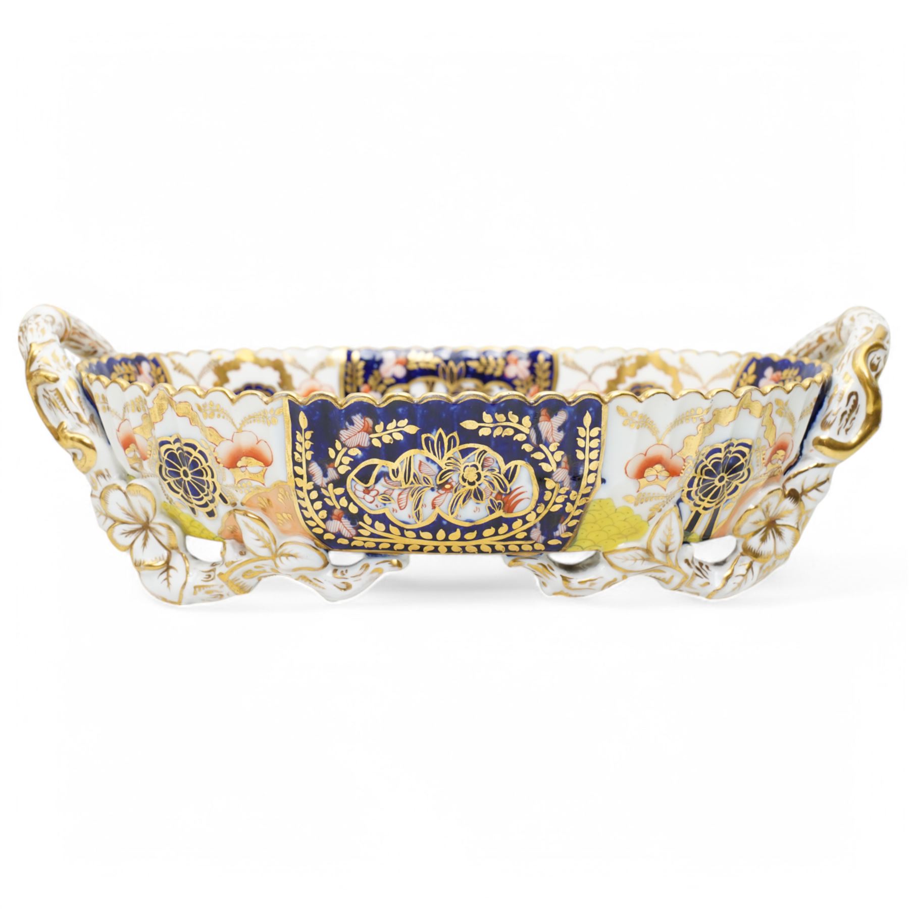 Large Victorian Copeland pedestal bowl decorated with Japanese flowers and birds, impressed mark D35cm and a Copeland two handled oval shallow dish with panels of Japanese flowers within a gilded scalloped rim, naturalistic handles and supports W30cm (2)
