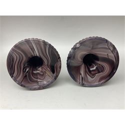 Daum glass two stemmed candle stick signed to verso, together with a pair of slag glass purple candle sticks, Daum H21cm