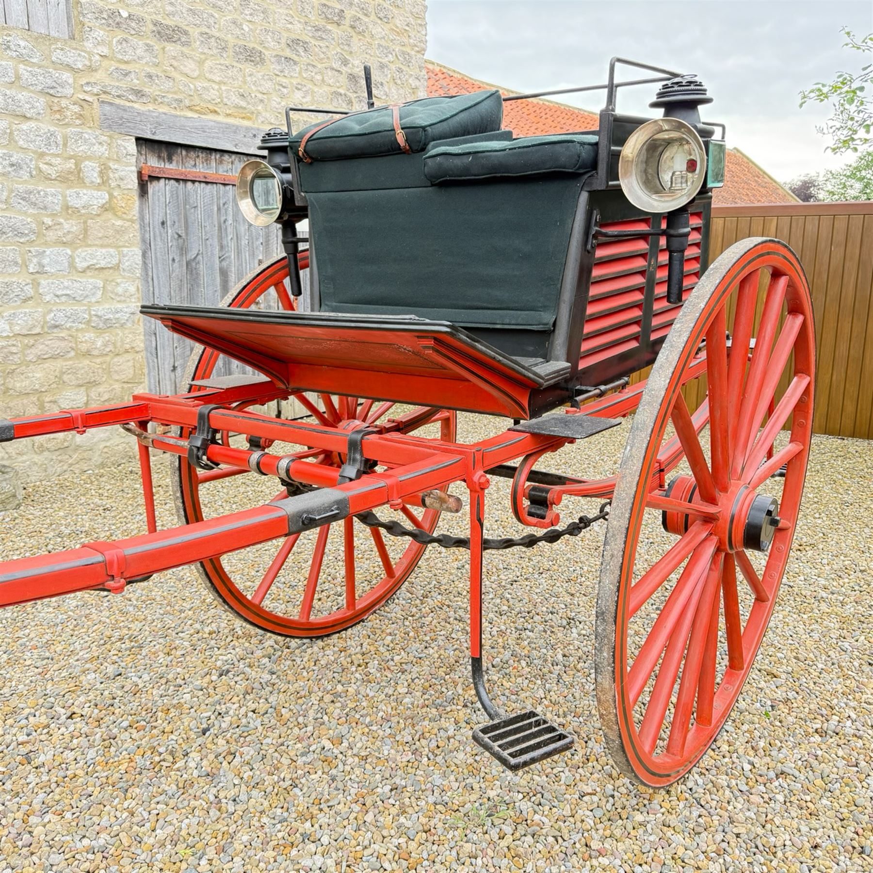 Holland & Holland Tandem Cart - Althorp Spencer Family Estate

A two wheeled tandem cart or cocking cart by Holland & Holland Coach Builders, London, with black painted bodywork, red painted shafts and running gear, red wooden spoked wheels with rubber tyres, green upholstered seating and a rear perforated metal footboard. The cart is fitted with carriage lamp brackets (lamps next lot), green buttoned cushions with leather retaining straps, side louvered body panels, footrests, leaf spring suspension and shafts for horse use. The carriage incorporates an adjustable body position, operated by a lever, allowing the body to be moved forwards or backwards to alter the weight distribution. Formerly owned by the family of Lady Diana Spencer,
Sympathetically conserved by Woods of Fairbourne Carriages Ltd, Kent.

Features:
• Brass maker’s plaque for Holland & Holland Coach Builders, London
• Two wheeled tandem cart
• Black painted body with red painted shafts and running gear
• Red wooden spoked wheels with rubber tyres
• Green upholstered cushions with leather retaining straps
• Adjustable carriage body for weight distribution
• Lever operated adjustment mechanism
• Perforated rear footboard
• Side footrests
• Louvered side panels
• Leaf spring suspension
• Rear opening storage compartment
• Decorative painted armorial motif to rear panel
• Fitted carriage lamps shown, not included in the lot (available as next lot)
• Conserved by Fairbourne Carriages Ltd
• Provenance: The Althorp Attic Sale including The Spencer Carriages, lot 195, 7 July 2010

Dimensions:
Overall length 396 / 198cm
Width 155cm
Height 190cm

Wheel Diameters:
Wheels: 148cm

Seating:
Driving seats: 2
Passenger seats: 2