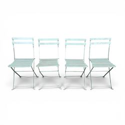 Wrought metal folding garden table, with painted wood plank top; and four matching folding chairs