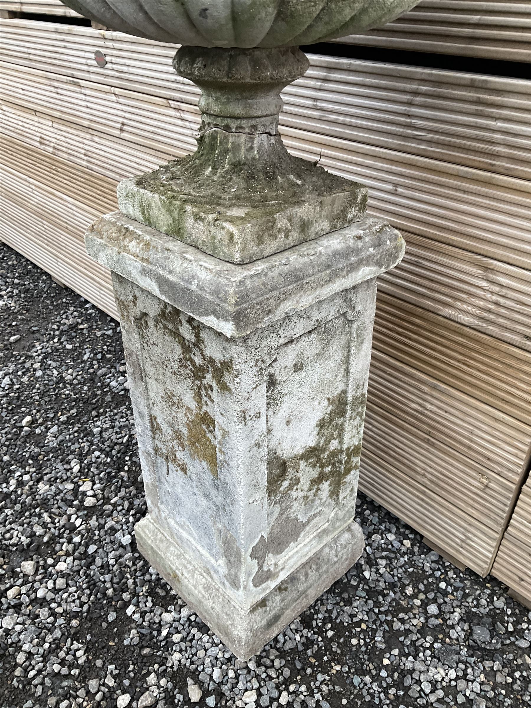 Cast stone urn on plinth, on tall square plinth - THIS LOT IS TO BE COLLECTED BY APPOINTMENT FROM DUGGLEBY STORAGE, GREAT HILL, EASTFIELD, SCARBOROUGH, YO11 3TX