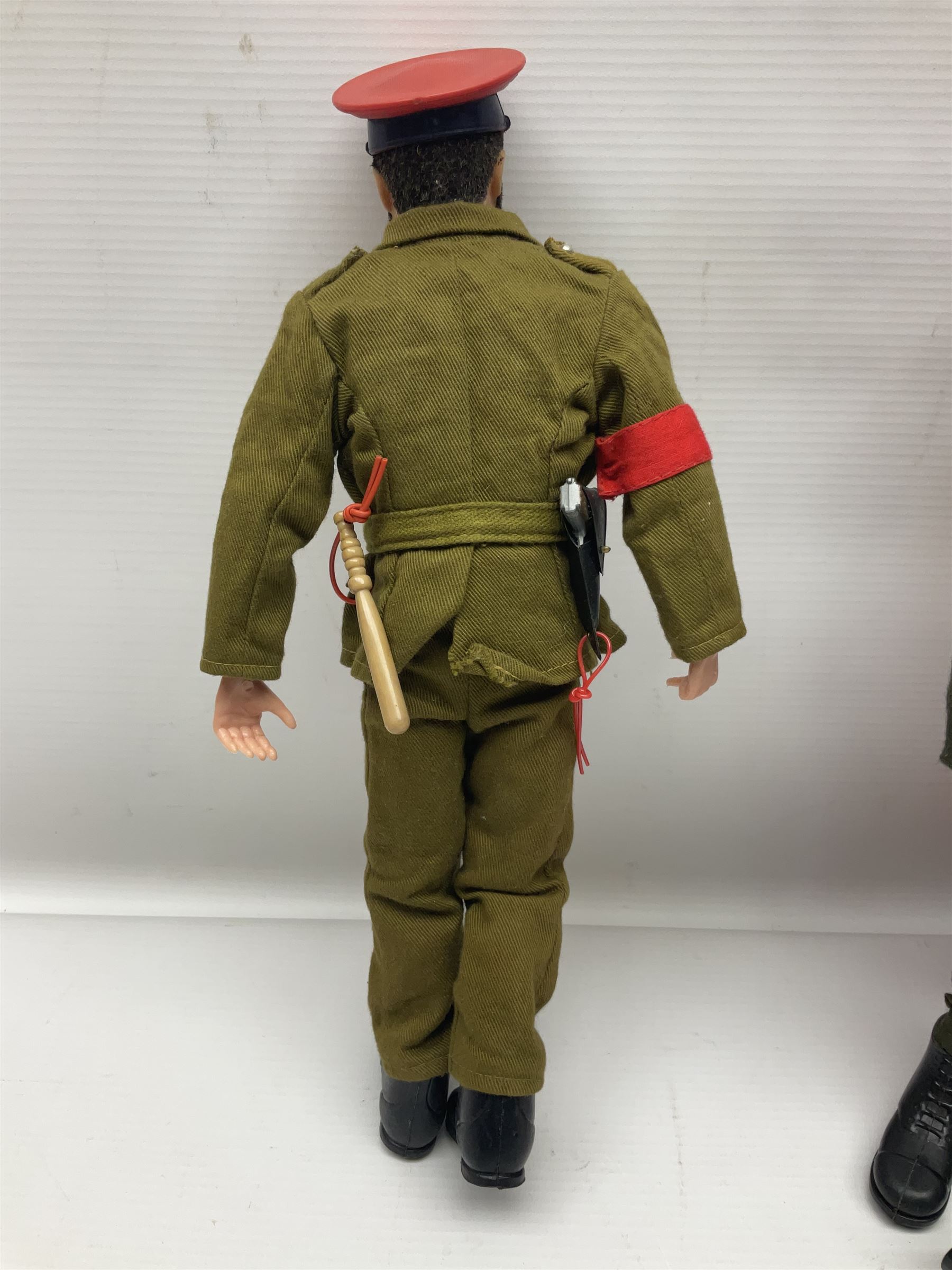 Palitoy Action Man Action Soldier No.34014 with tunic, belt, trousers, boots, blue beret and sten gun; in original box; and Palitoy Action Man Royal Military Policeman (RMP) gripping hands figure, marked 'Made in England by Palitoy under licence from Hasbro © 1964' to rear of torso; with tunic, shirt, trousers, tie, boots, belt, truncheon, pistol in holster, MP armband, red cap, Sterling machine gun and other clothing etc; in anrelated display box (2)
