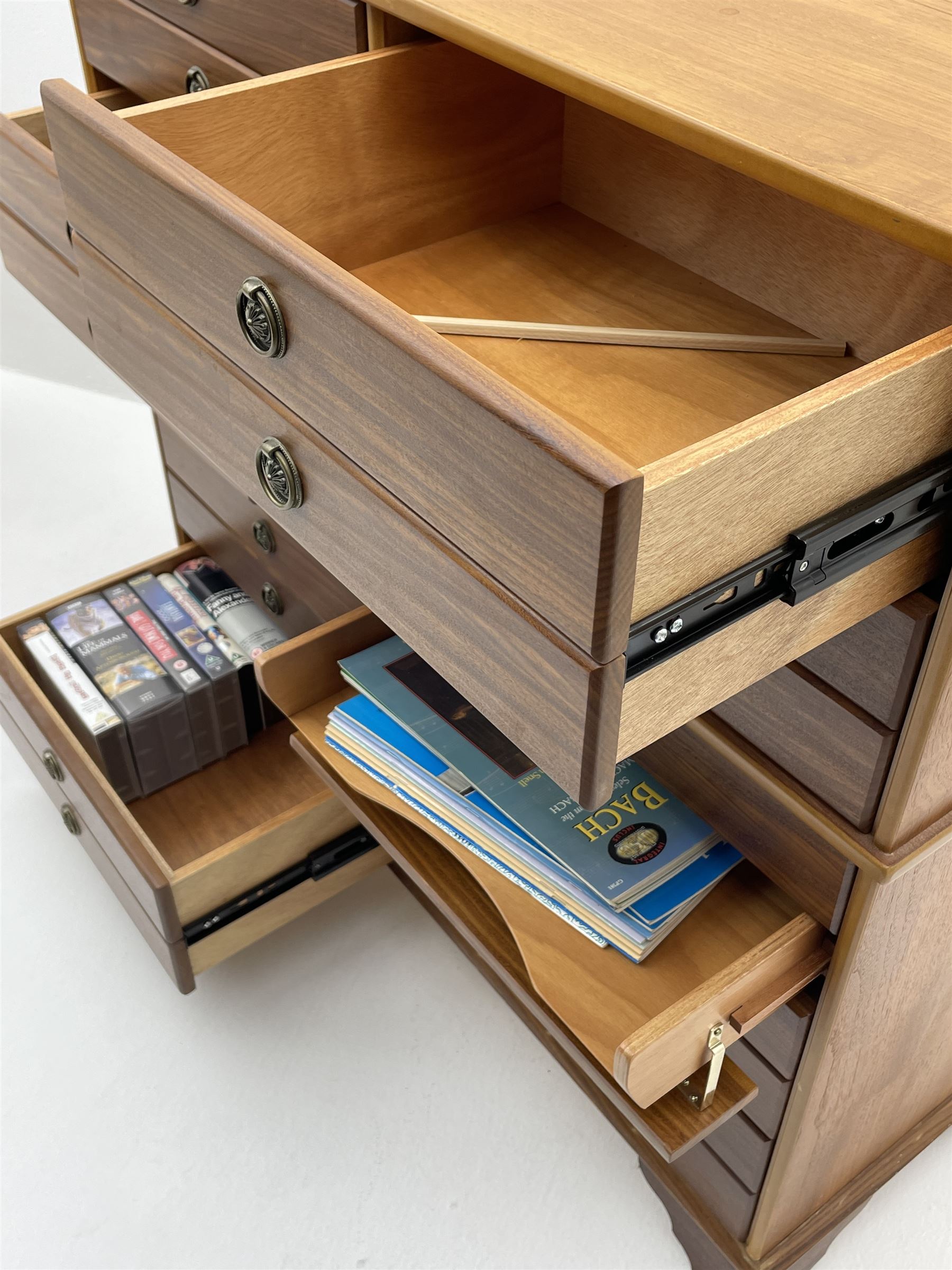 Teak multi-drawer music chest, fitted with eight drawers and four manuscript drawers with fall fronts, with contents