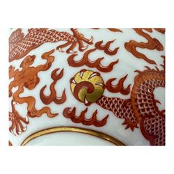 Chinese porcelain iron red tea bowl, the exterior painted with two five claw dragons chasing the flaming pearl, amidst clouds, red Quinlong seal mark beneath, D10.5cm x H6.5cm