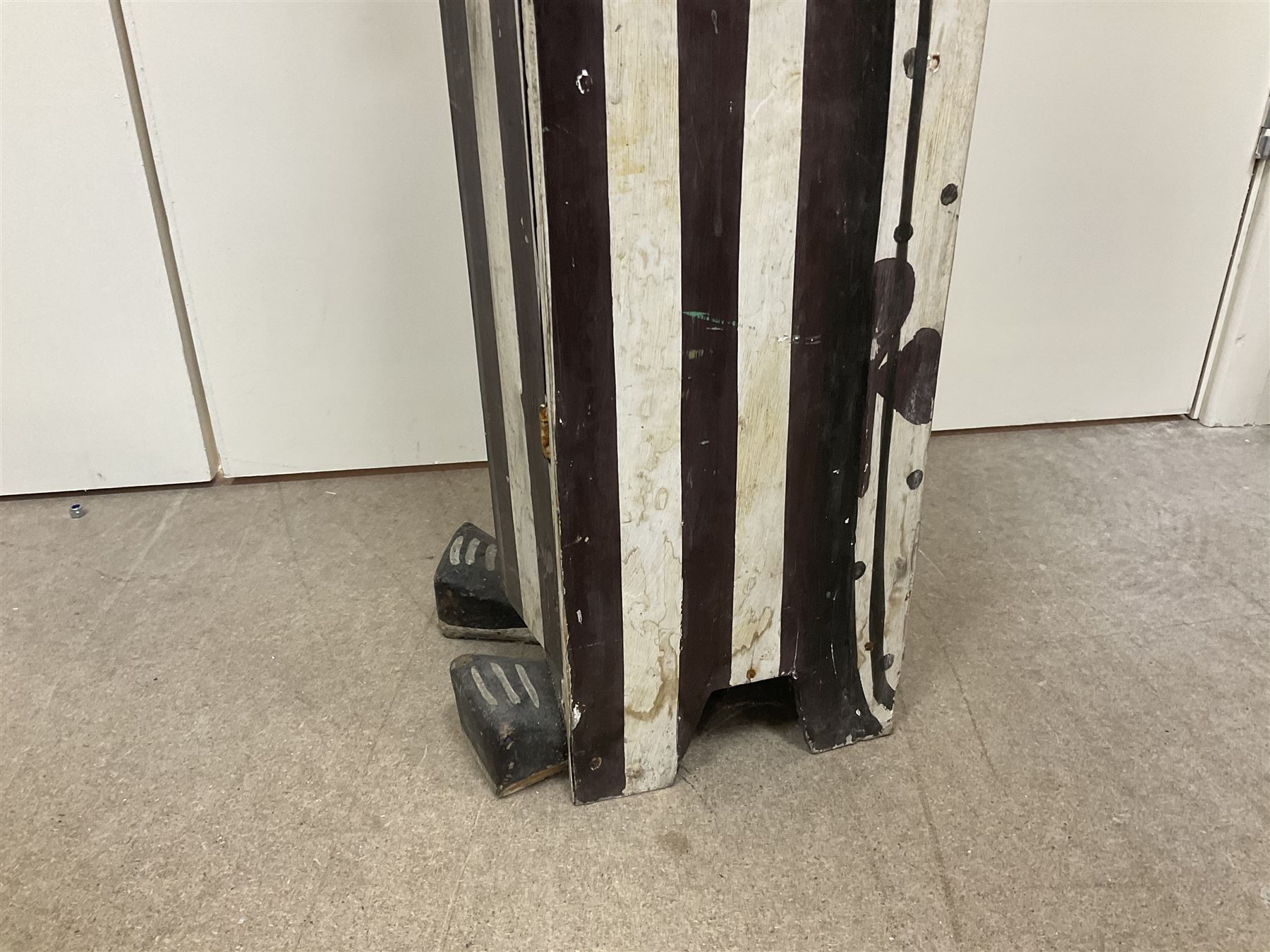 Folk art circus clown cabinet, the the two hinged doors with bow tie decoration opening to reveal fitted shelved interior, the body painted with polka dots and spades, H121cm