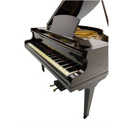 A mid 20th century English baby grand piano by Osbert, with an iron frame and overstrung stringing in a mahogany case,  conforming Lyre with sustain and una corda pedals and music desk, with original stringing, hammer action, dampers and felts, 7-1/4 octaves with 88 original ebony and ivory covered keys, with stool