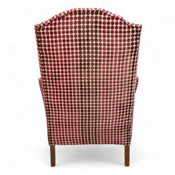 Late 20th century Georgian style wingback armchair with matching footstool, upholstered in red and cream geometric fabric, raised on cabriole front legs