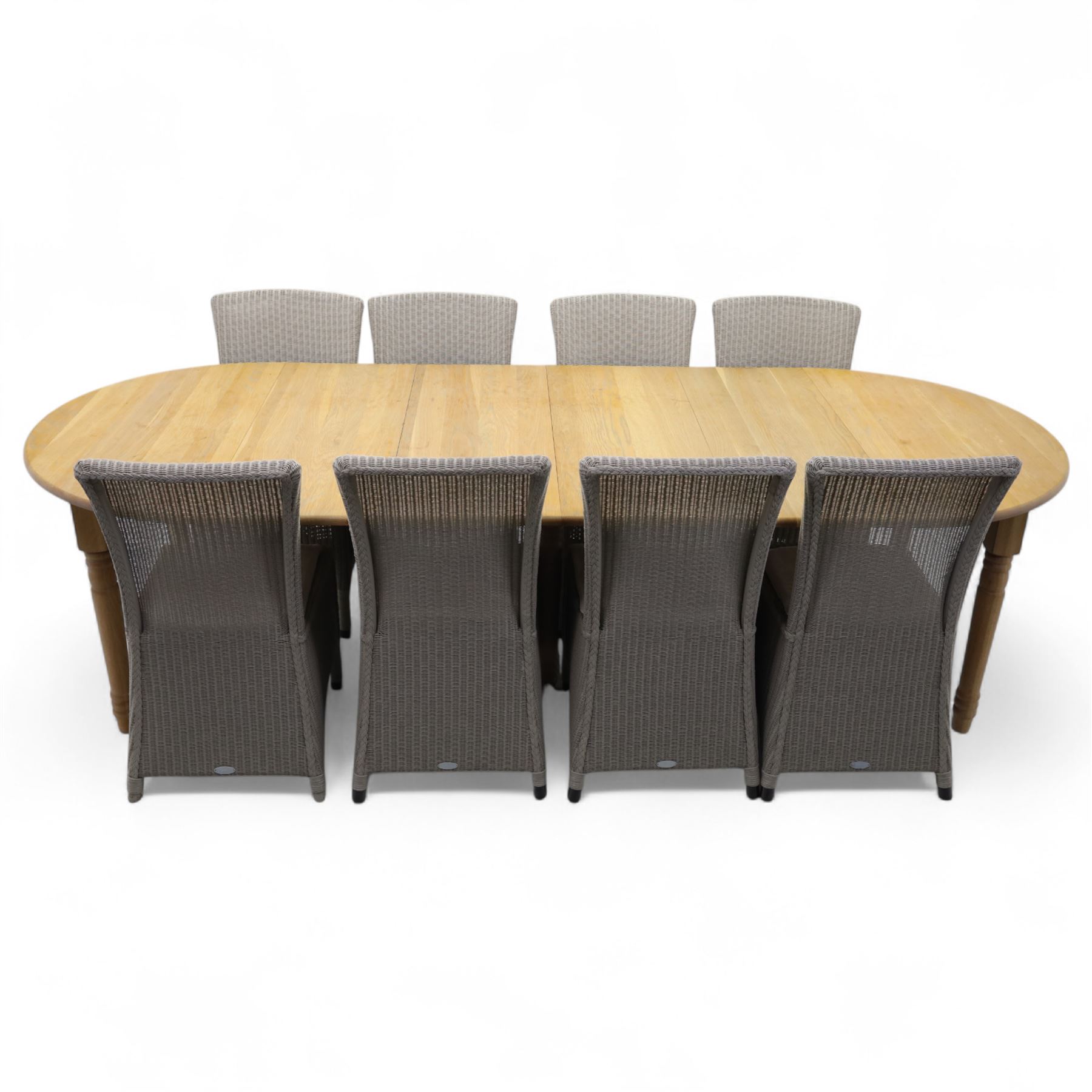 Neptune – Sheldrake limed oak extendable dining table and eight Havan loom chairs, the oval top in limed oak finish with four additional leaves extending the table to seat up to ten (Extends to cm), raised on turned legs with two additional centre supports, the matching Havan loom chairs finished in grey with cream upholstered seat covers (H 95cm, W 47cm, D 55cm)