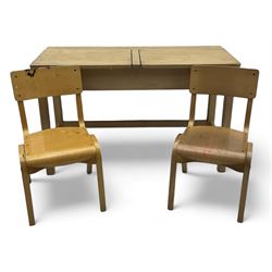 Mid-20th century beechwood school desk, rectangular lift-top desk with storage compartment, supported by square legs with cross stretchers; two matching beech chairs (3)