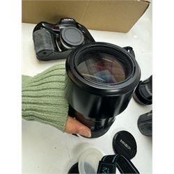 Six Minolta Dynax SLR camera bodies, comprising 800si serial no. 62703606, three 7xi examples, including one boxed example, serial nos. 20106944, 16123311 & 22107553, and two 9xi examples, serial no. 18209901 & 18202113, with three Minolta lenses, including Zoom xi 28-105mm 1:3.5(22)-4.5 lens, AF Zoom 28-85mm 1:3.5 (22)-4.5 lens and an AF Zoom 75-300mm 1:4.5(32)-5.6 lens, Hama carry case and other accessories