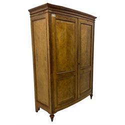 Frank Hudson - mid-20th century Mindi ash and burr walnut double wardrobe, moulded rectangular cornice over two panelled doors with chevron pattern veneers, raised on turned supports