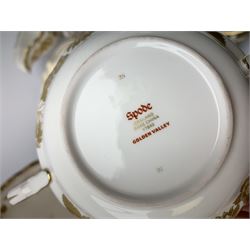 Extensive Spode dinner and tea service, decorated in the Golden Valley pattern, comprising eighteen dinner plates, ten salad plates, ten side plates, ten twin handled soup bowls and ten saucers, ten bowls, two sauce boats and two stands, two square serving dishes, smaller oval serving dish, two tureens and covers, two large oval serving platters, one smaller example, teapot, coffee pot, milk jug, twin handled lidded sucrier, and ten teacups and ten saucers, with red printed marks beneath 