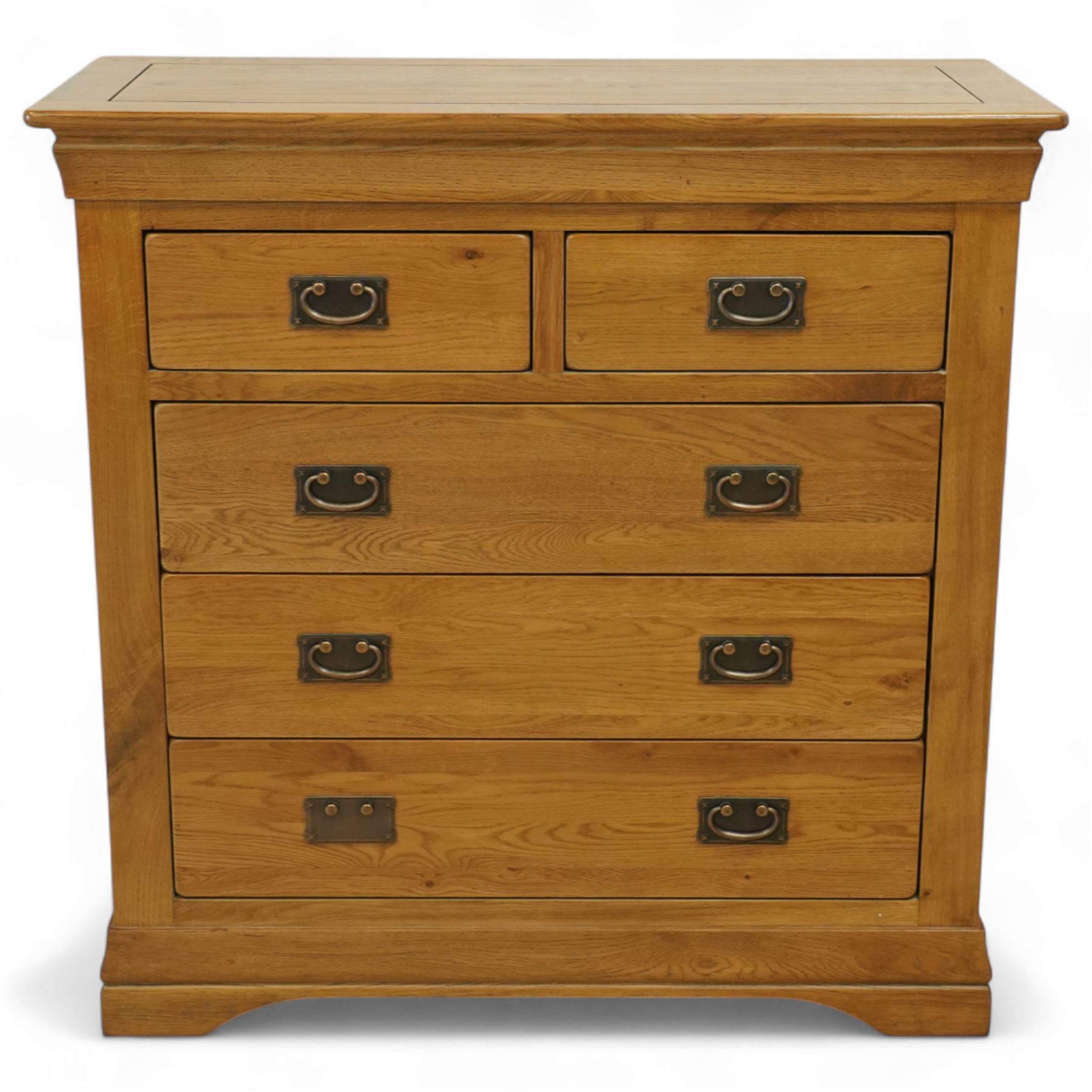 Contemporary solid oak five drawer chest, the rectangular top with inset panels over two short and three full-width drawers, all with brass-effect drop handles, raised on a plinth base
