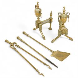 19th century brass and iron fire dogs with fire irons, the fire dogs each with urn finials...