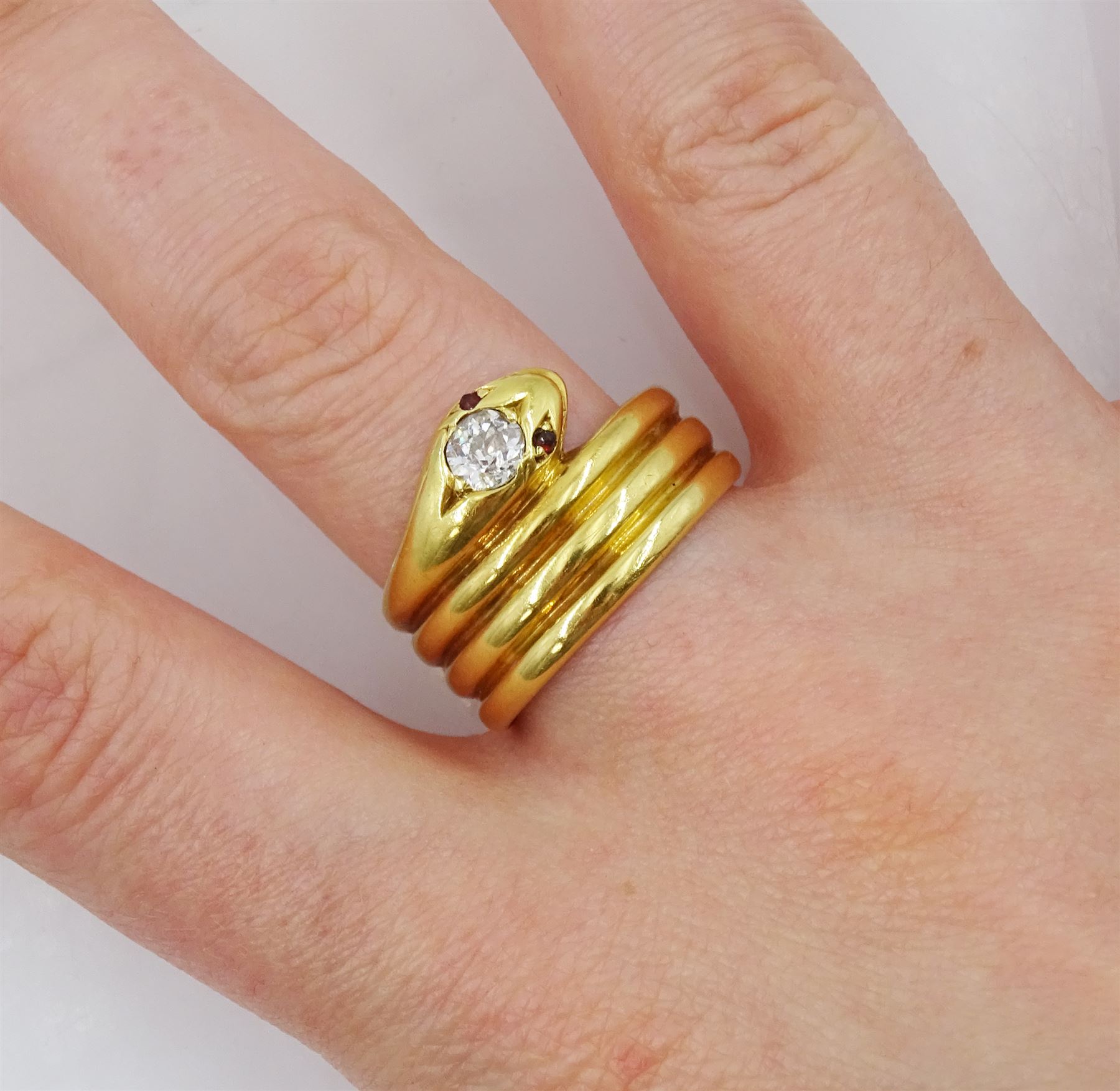 Victorian 18ct gold coiled snake ring, the head set with a single stone diamond and stone set eyes, makers mark EB, London 1886, diamond approx 0.35 carat