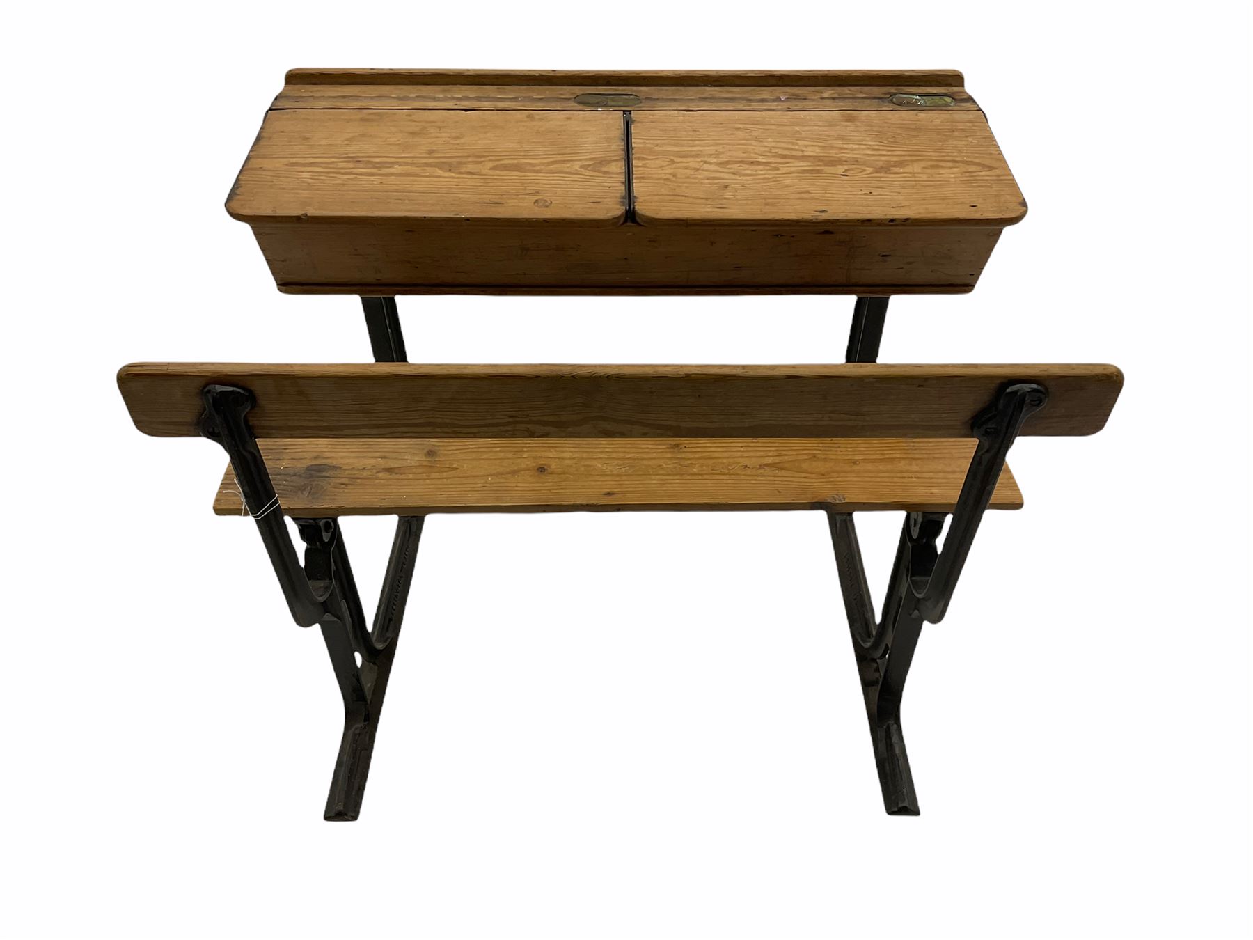 Early 20th century school desk, pine and cast iron, two sectional with hinged lids, the irons marked ‘Addision Ltd.’