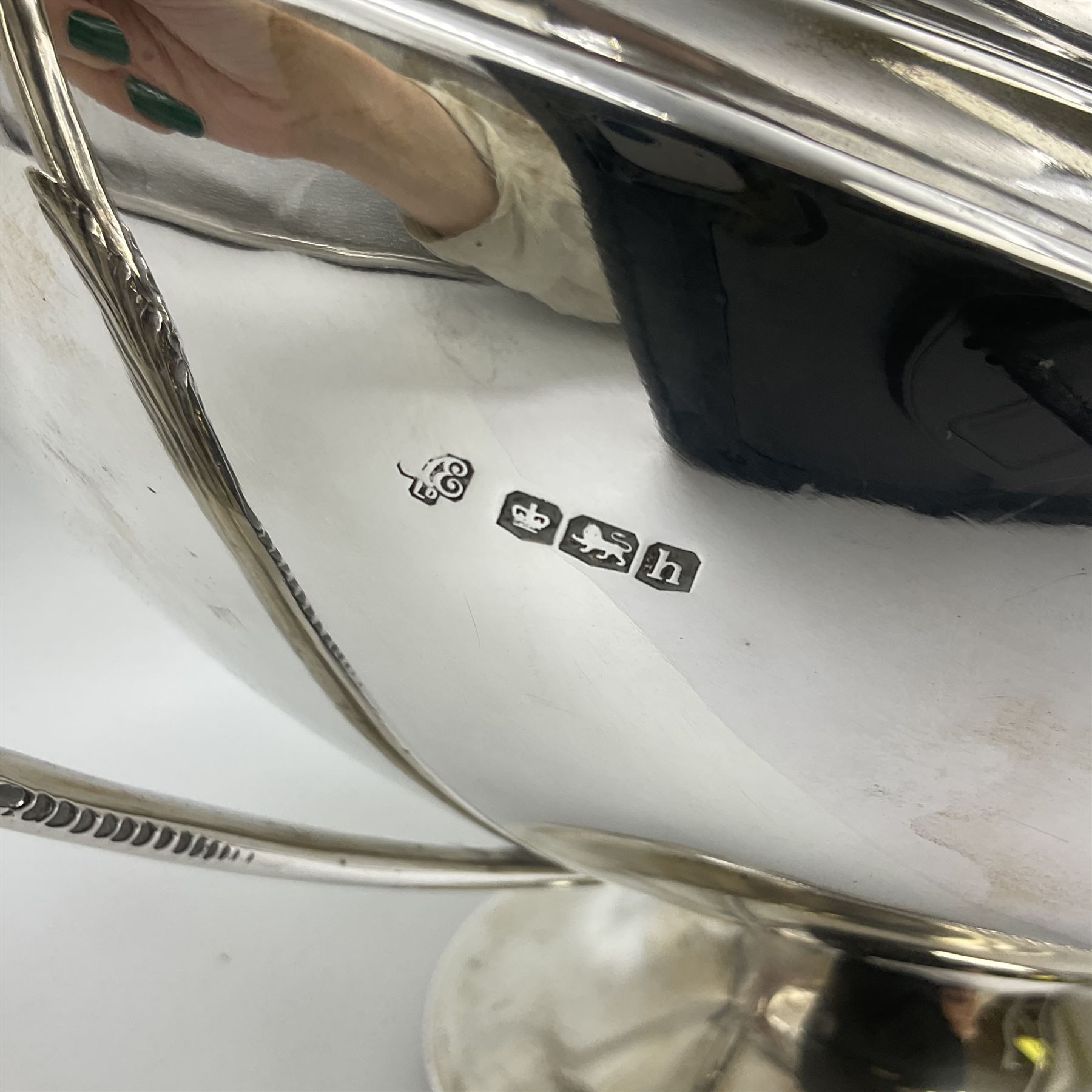 1920s silver twin-handled pedestal bowl, of navette form with twin bifurcated acanthus capped scroll handles, engraved with initial R to body and upon spreading oval foot, hallmarked Hawksworth, Eyre & Co Ltd, Sheffield 1925, including handles H21.8cm