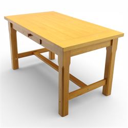 Solid oak dining table and set of seven pine farmhouse chairs including two carvers, rectangular top with tongue and groove style finish, supported a 'H' stretcher with square chamfered legs, pine farmhouse chairs with central splat and turned legs