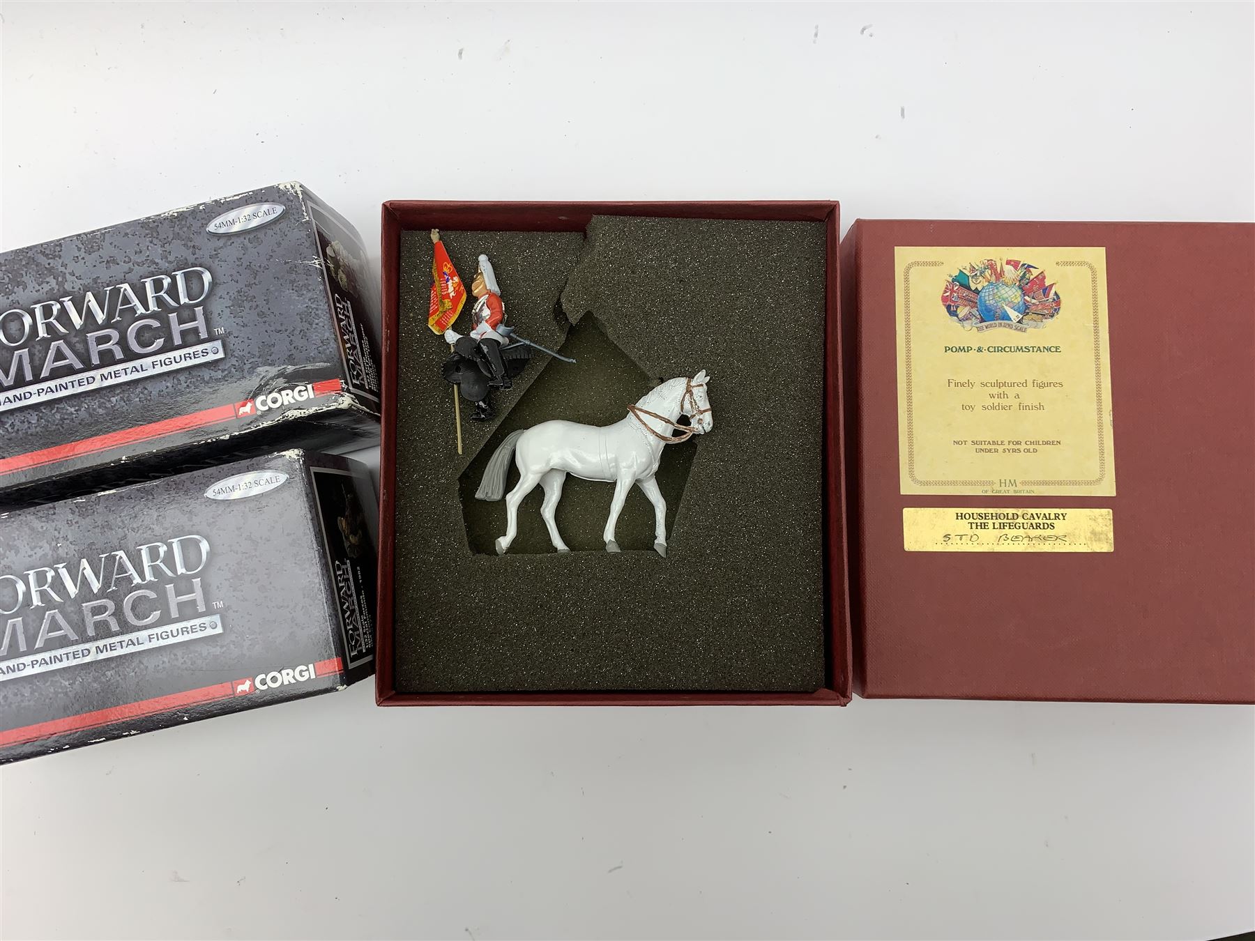 Various makers metal figures including M.J. Mode East Kent Regiment; Whitby Militaire Swiss Guards; HM Household Cavalry The Lifeguards Standard Bearer; Little Lead Londoners Coldstream Guards Band; Good Soldiers Dad's Army; and two Corgi Forward March figures; all mint and boxed; and a quantity of unboxed figures including Sherlock Holmes & Dr. Watson, Darth Vader etc