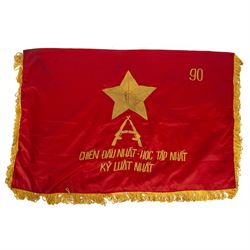 Vietnam War; two North Vietnamese military flags, together with a United States Marine Corps Vietnam period stars and stripes flag 