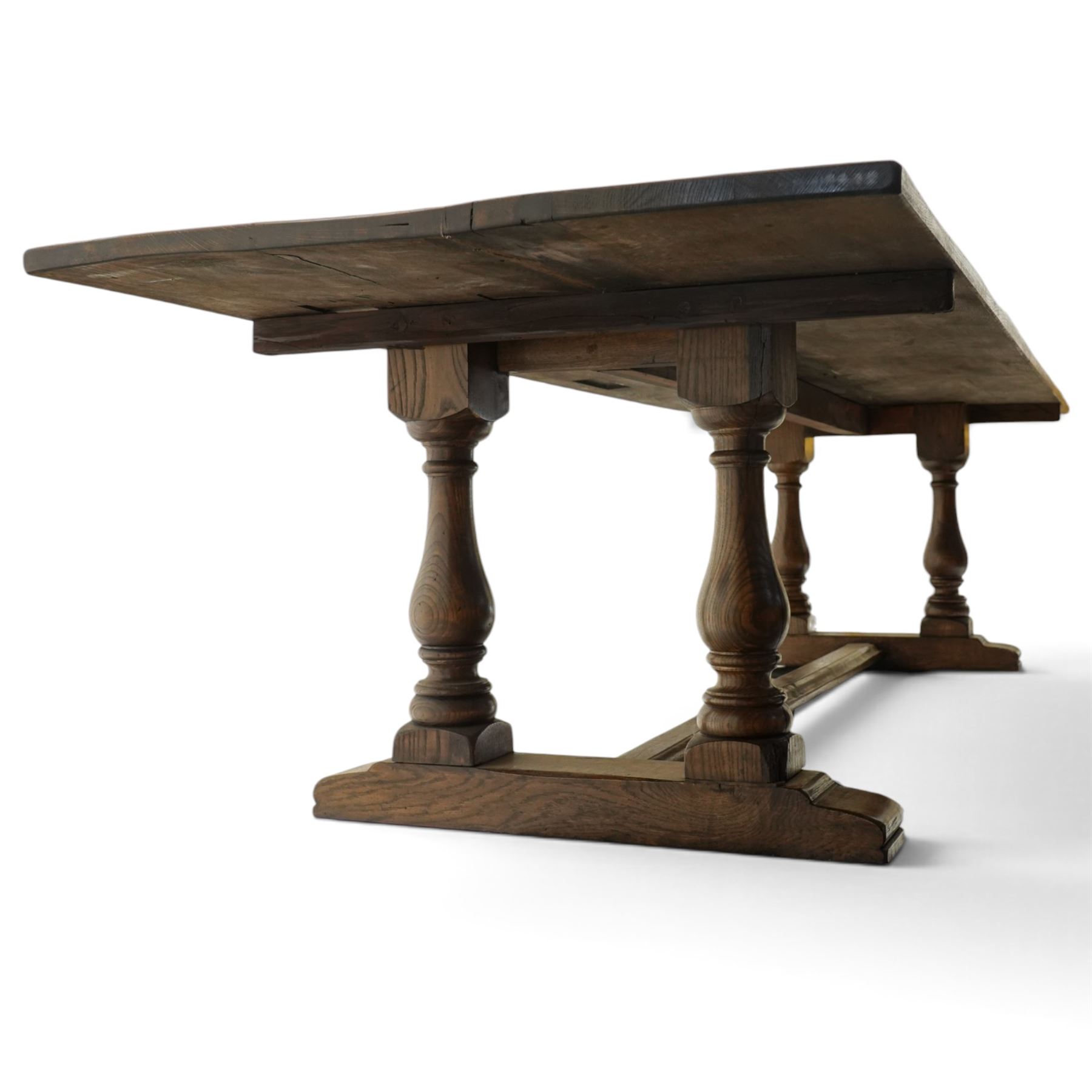 Large 17th century design oak 10ft refectory dining table, the rectangular top raised on twin double-vasiform pedestal end supports on sledge feet, united by chamfered stretcher