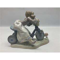 Lladro figure, In No Hurry, modelled as a girl on a tricycle, sculpted by Francisco Polope, with original box, no 5679, year issued 1990, year retired 1994, H15cm