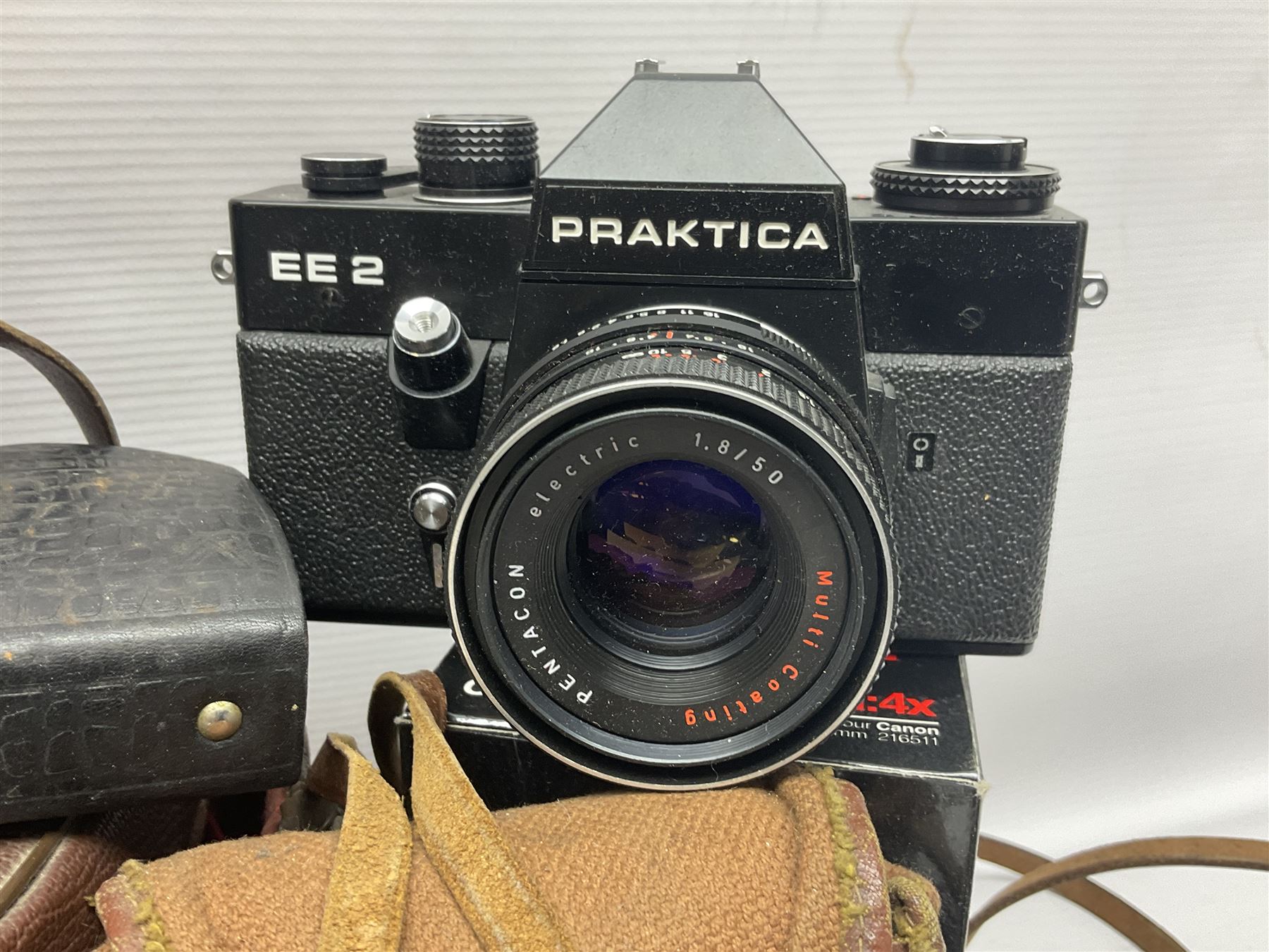 Collection of cameras and lenses, to include Pentax Program A camera body, serial no 123759, with 'Pentax-A zoom 1:3.5-4.5 28-80mm' len, Praktica EE2 camera body with 'Pentacon electric 1.8/50' lens etc, together with a Manfrotto tripod 