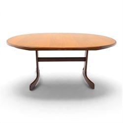 G Plan - Mid 20th century teak extending dining table and four chairs, oval top with stowed fold-over leaf extending to 208cm, raised on two shaped supports united by a stretcher 