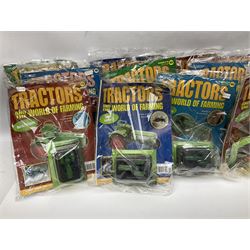 Eighteen issues of Tractors and The World of Farming magazine, together with sixty diecast tractors, all in original packaging, in three boxes 