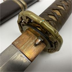 WW2 Japanese Army officer's shin gunto/katana sword with 68.5cm steel single edged blade, foliate cast brass tsuba, bound fish-skin grip with brass mounts, inscribed marks to both sides of tang; in lacquered wooden scabbard with brass mounts and locking button L97cm overall