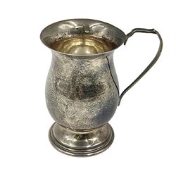 Modern silver christening mug, of waisted cylindrical form, with angular handle and upon stepped circular foot, hallmarked W I Broadway & Co, Birmingham 1978, H8.7cm