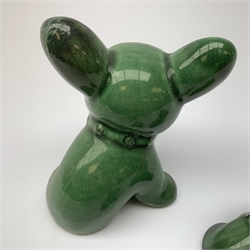 A graduated set of three Denby green glazed dogs, largest marked beneath, largest H15cm. 